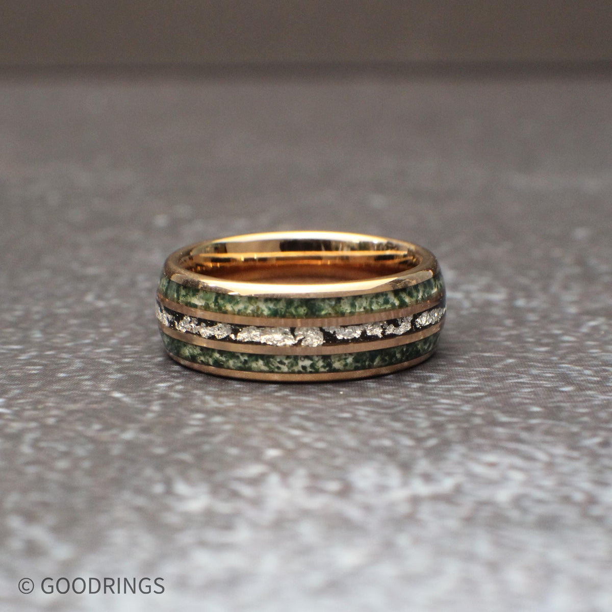 Mens moss agate tungsten ring with silver leaf center line and rose gold core close up