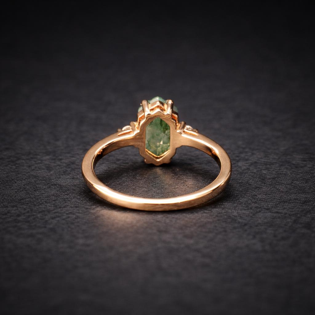 Back view of a moss agate promise ring on a black background.