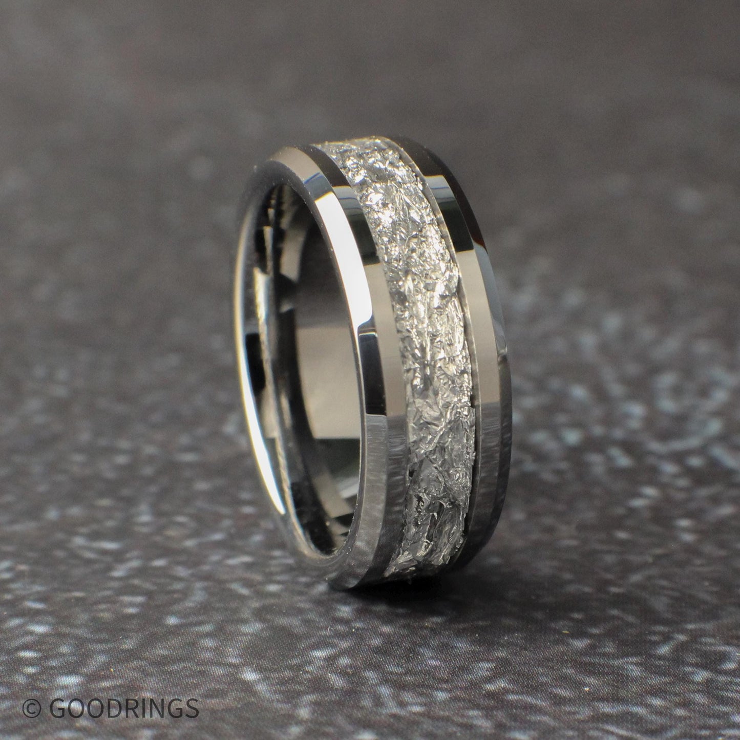 Silver wedding ring for men at a slight angle. The ring is 8mm wide and has beveled edges