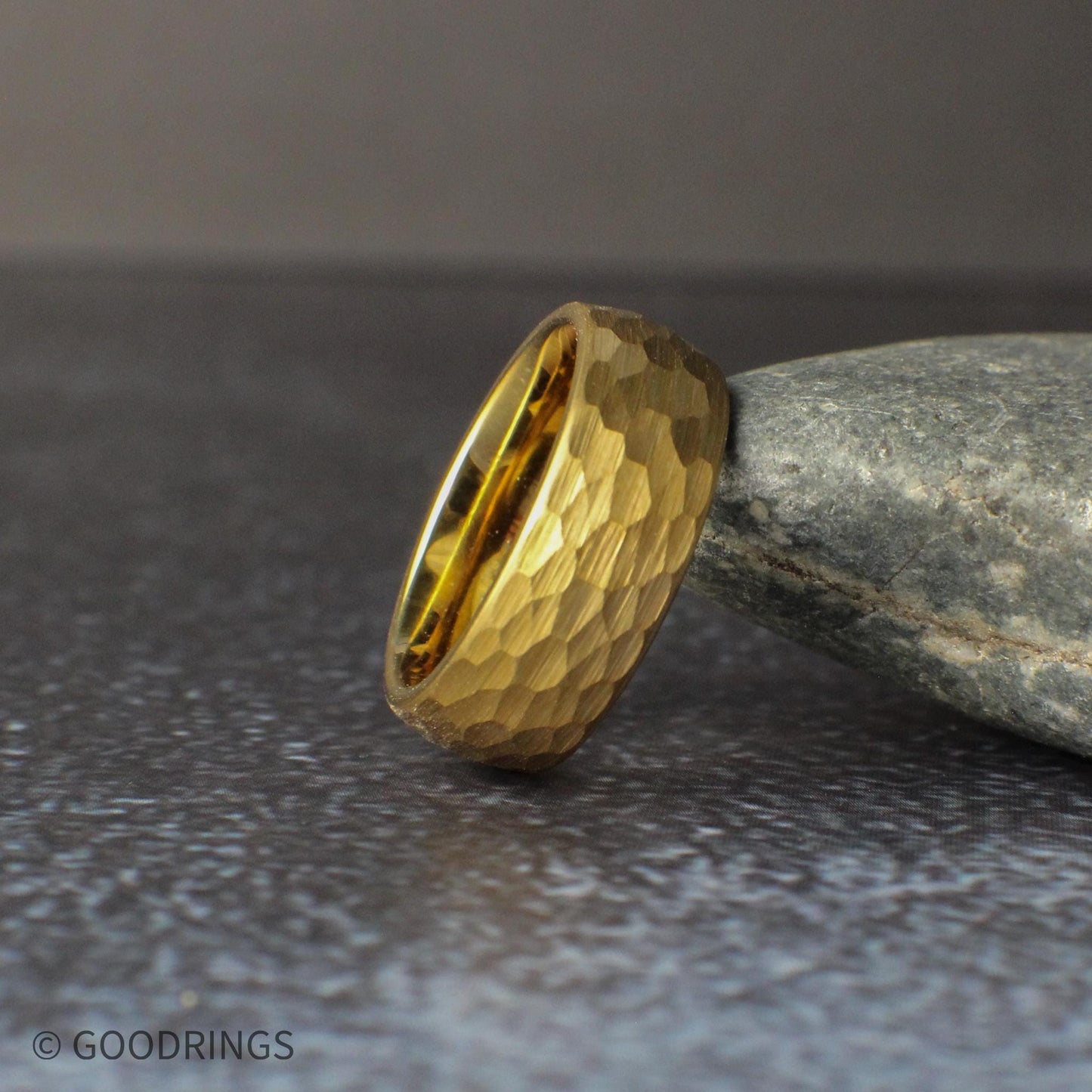 Hammered gold tungsten ring with a rich 18K gold plated finish and comfort fit interior, designed for everyday wear. The textured surface creates depth and reflection, making this ring a perfect choice for modern wedding bands, anniversary gifts, or minimalist gold jewelry.