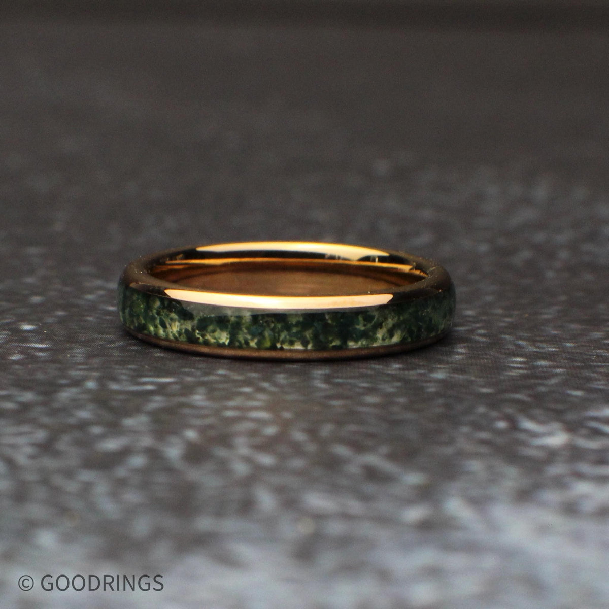 4mm wide moss agate ring laying flat