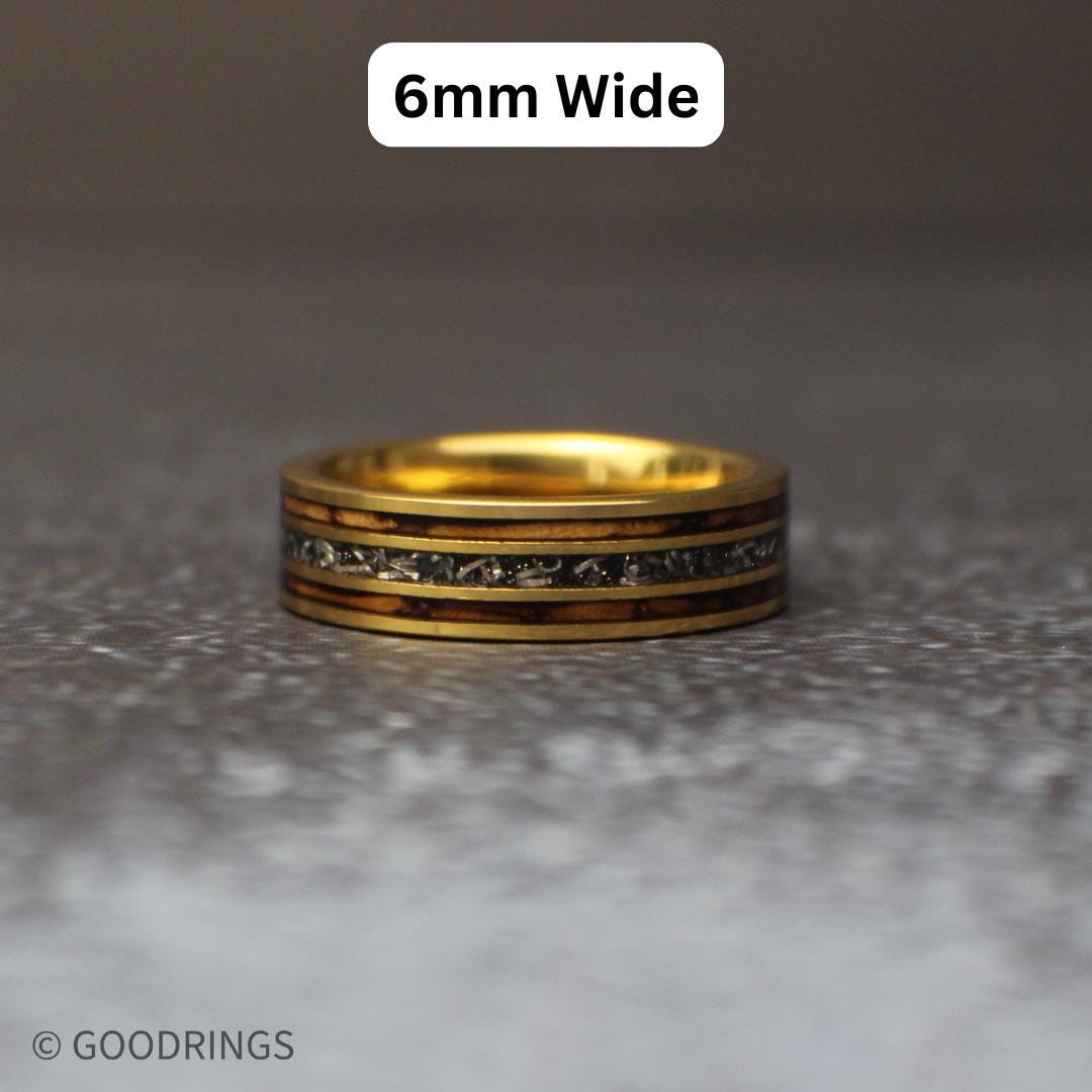 A meteorite ring laying flat with text above it saying 6mm wide.