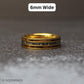 A meteorite ring laying flat with text above it saying 6mm wide.