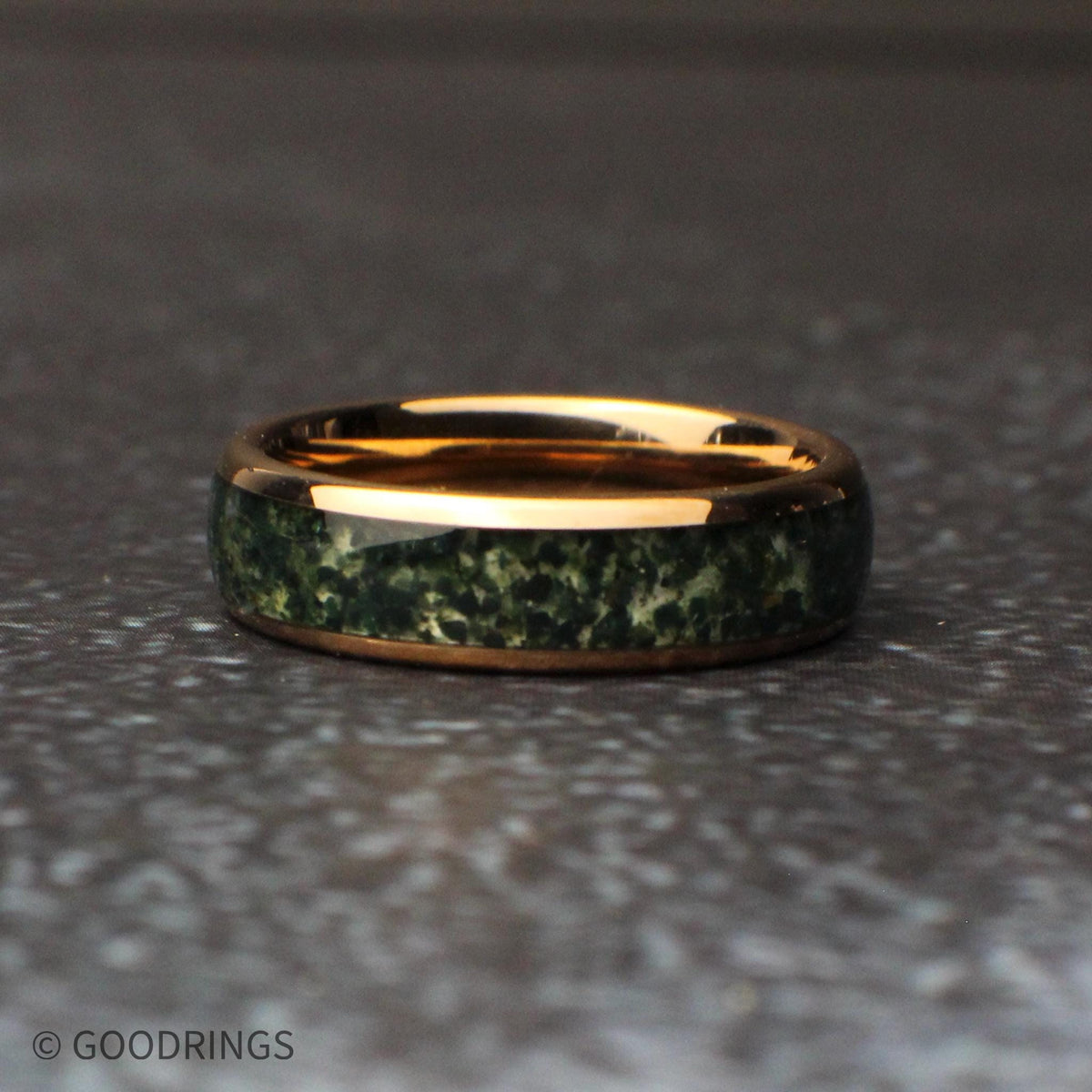 6mm wide moss agate ring laying flat