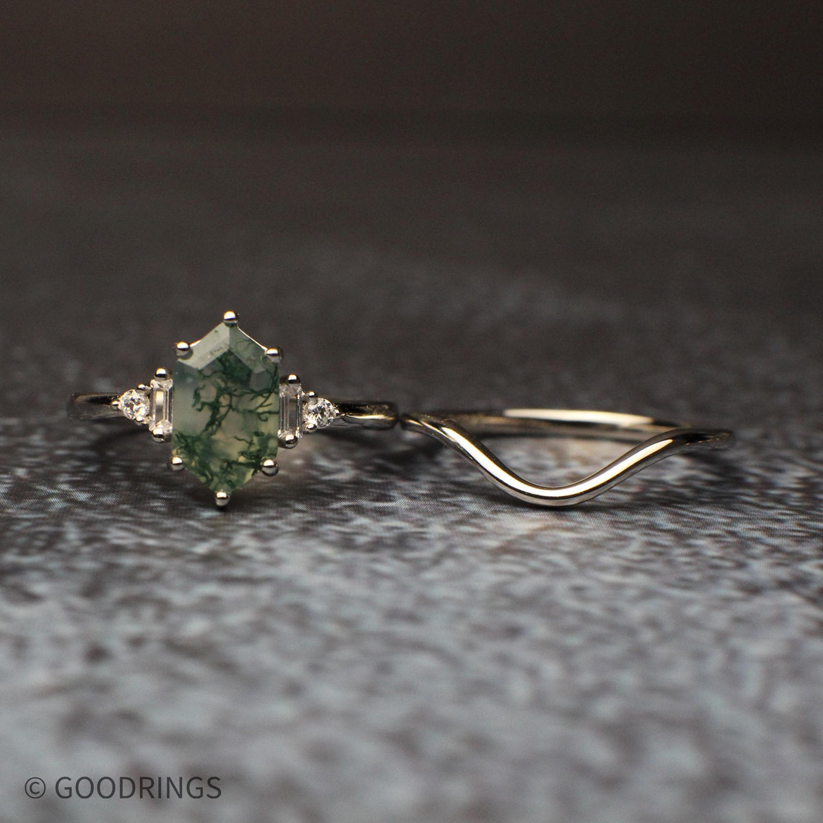 Side view of moss agate engagement ring and matching curved wedding band, sterling silver with cubic zirconia stones