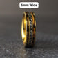 A mens gold wedding ring standing straight up with text above it saying "6mm wide"