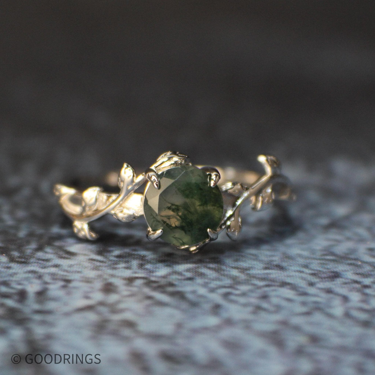Female moss agate ring with darker green stone