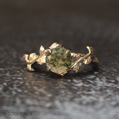 awesome pattern in moss agate ring in a sterling silver setting with leaves.