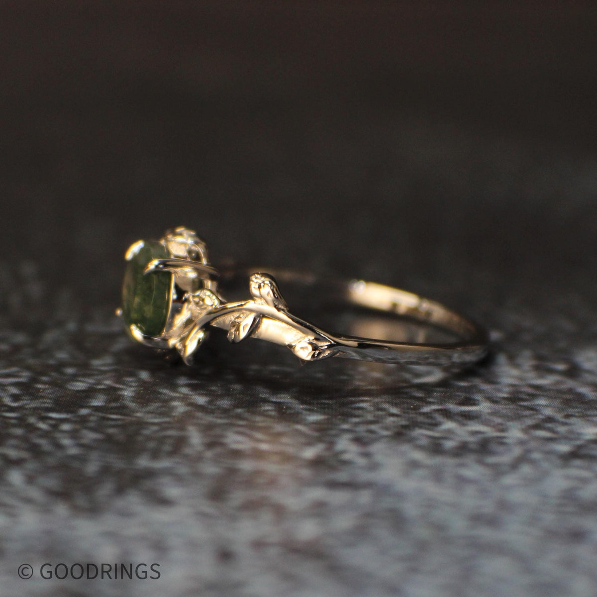 Side view of female moss agate wedding ring