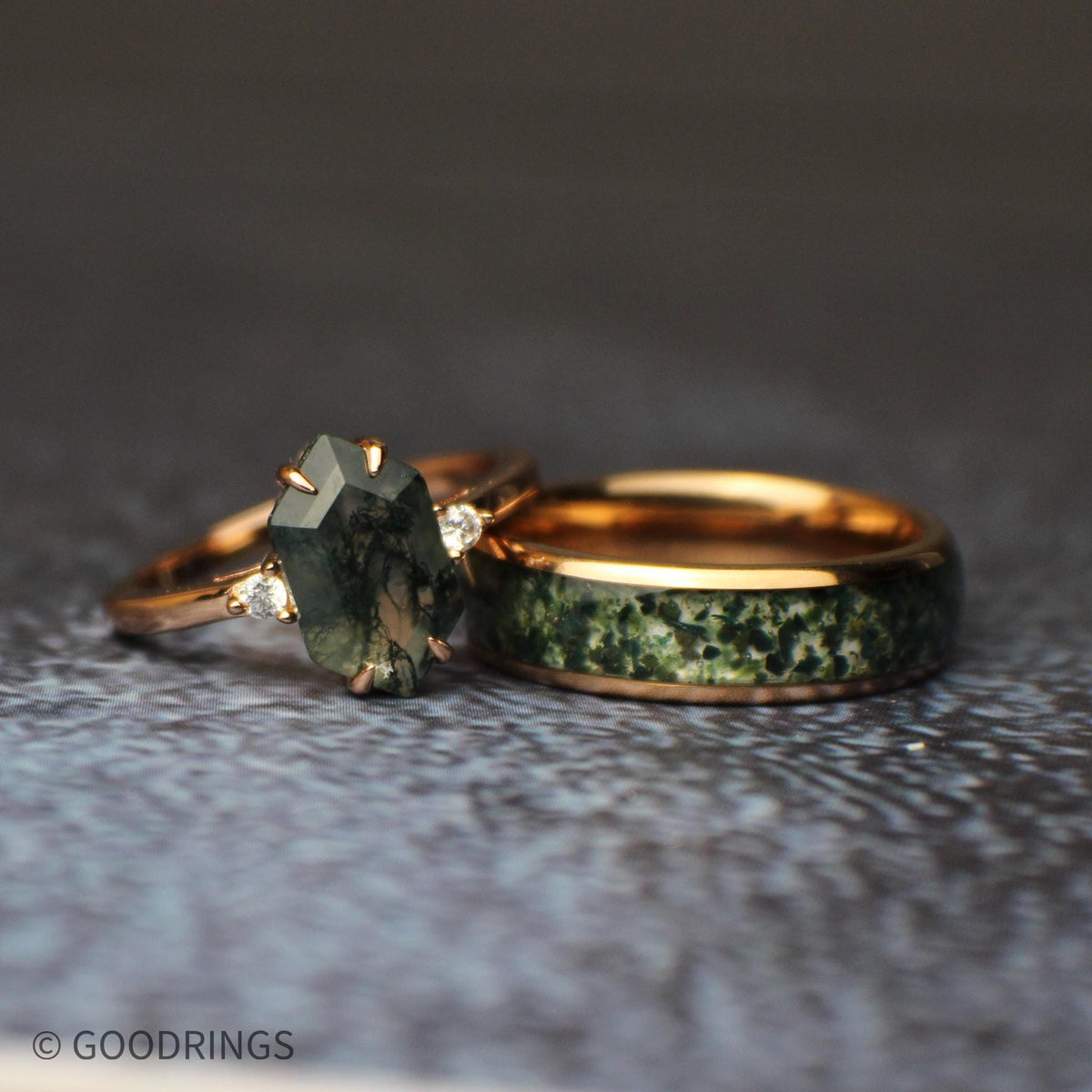 wedding set showing a moss agate ring leaning on the mens moss agate ring
