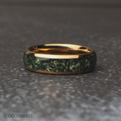 Mens moss agate ring laying on its side