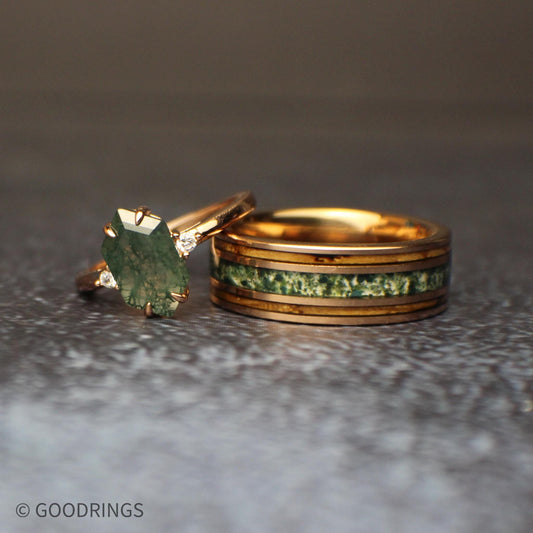 Picture of a couple's wedding rings with whiskey barrel and moss agate