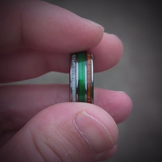 Video of the fishing line wedding band. The ring has green fishing line in the center and is bordered by Elk antler and Makore wood!
