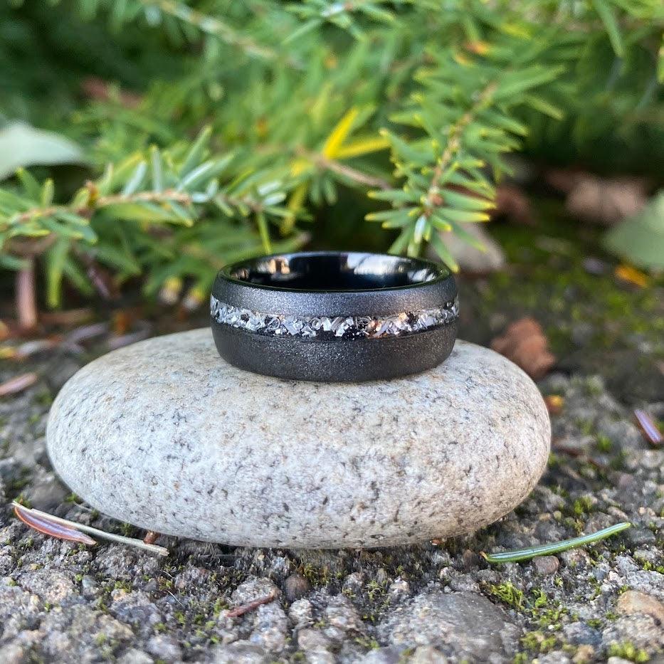 Meteorite shavings in an offset sand blasted wedding ring