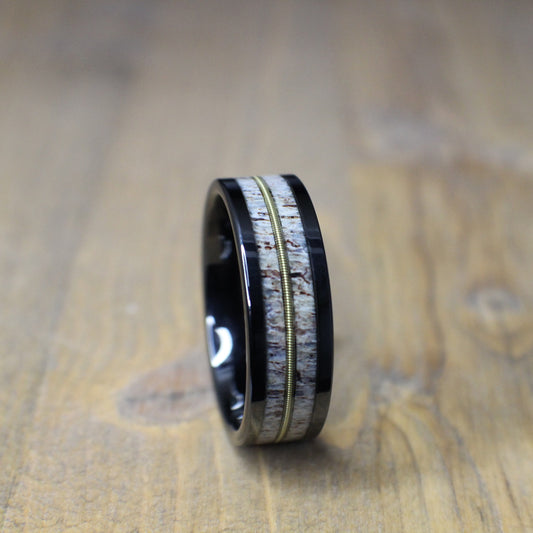 Antler ring with guitar string in a tungsten core.