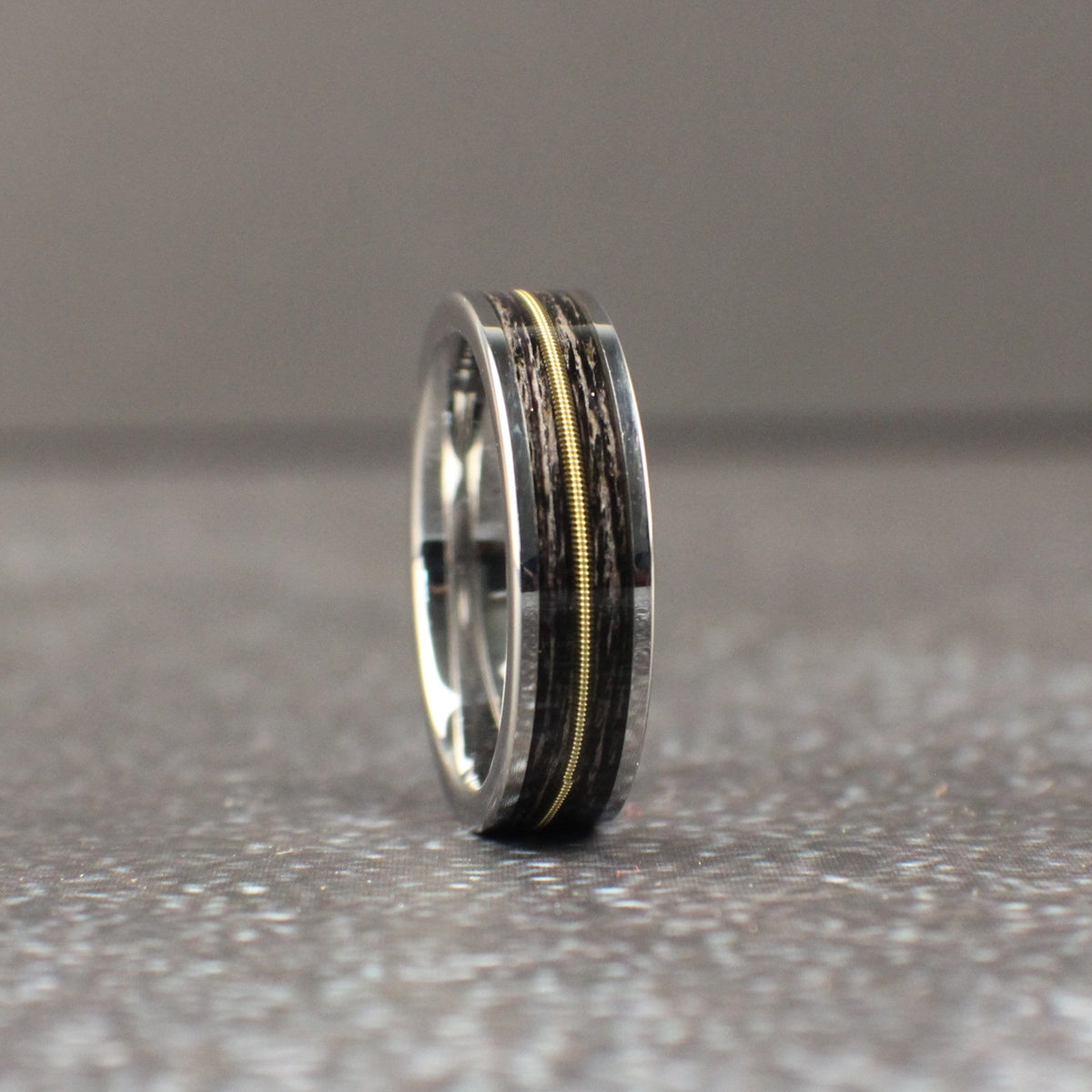 Tungsten wedding ring with guitar string